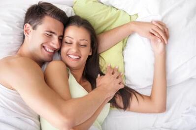 Happy boy and girl in bed